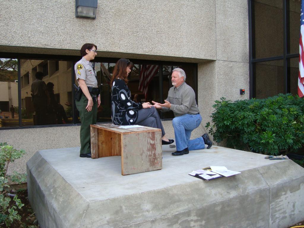 Site planning — Rebecca Basford with artist and client on location